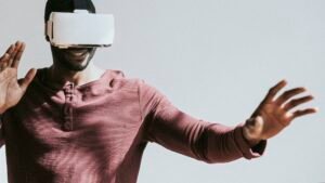Black man experiencing virtual reality with VR headset