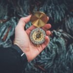 person holding compass