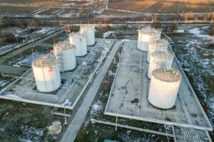 Aerial view of big fuel reservoires in petrol industrial zone in winter